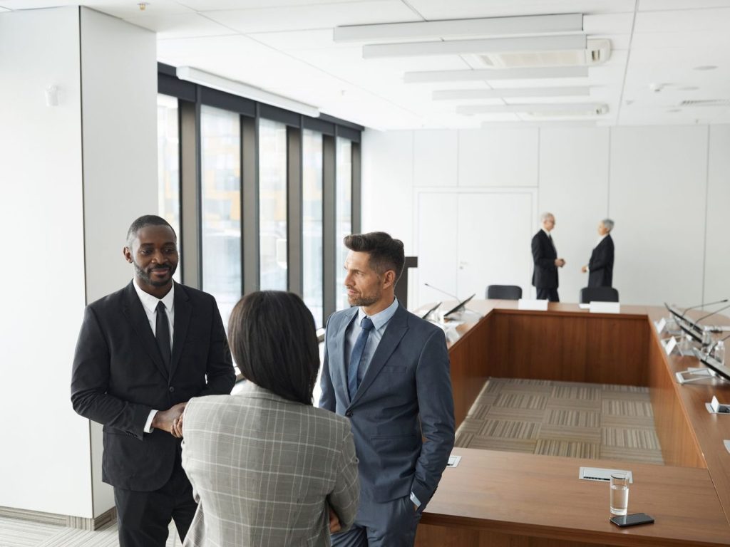 Executives talking in a modern conference room
