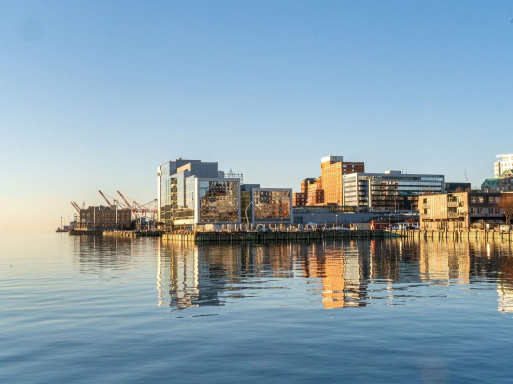 Halifax waterfront on calm water under a clear sky