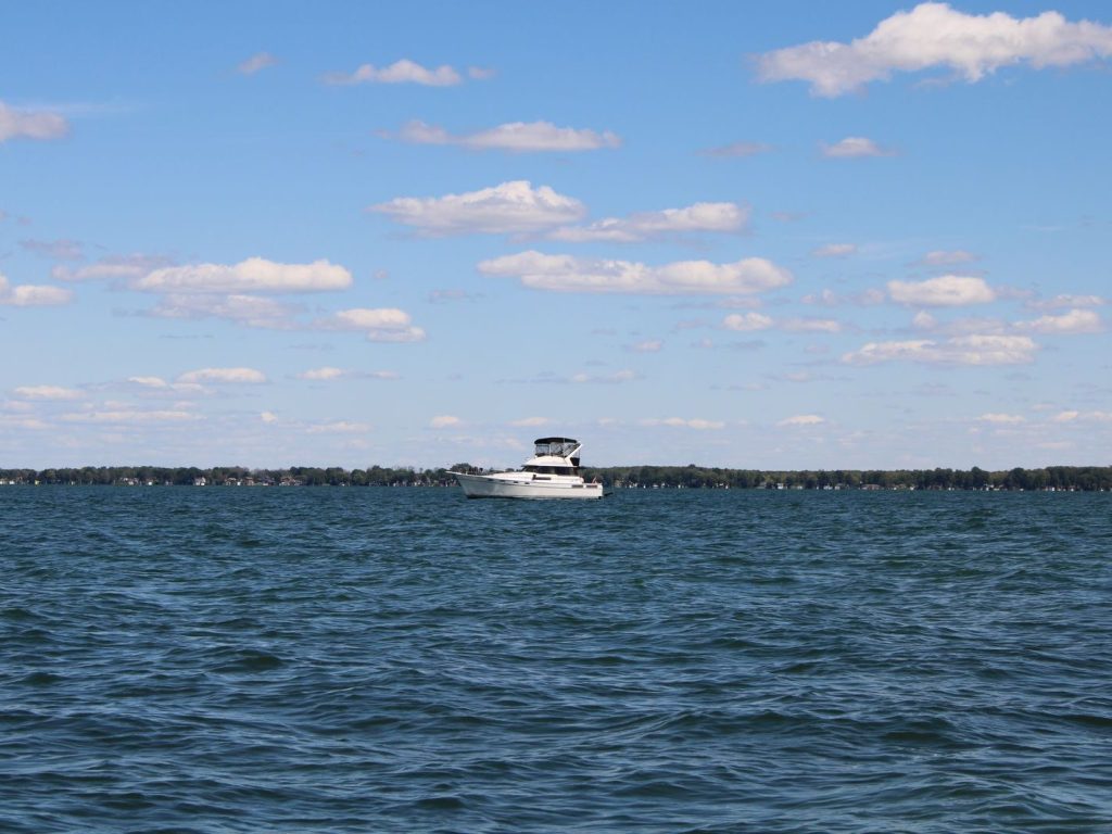 A boat on Lake Simcoe under a clear sky