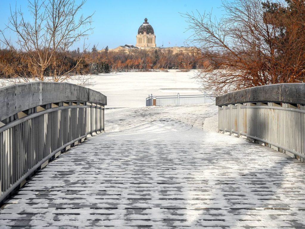 Snowy footbridge leading to the Saskatchewan Legislative Building in Regina