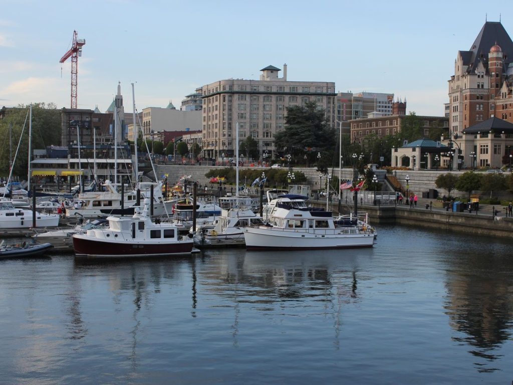 Victoria's harbour with moored boats and historic buildings