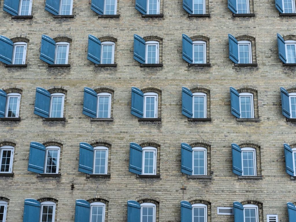 Brick building with blue shutters in Waterloo, Ontario